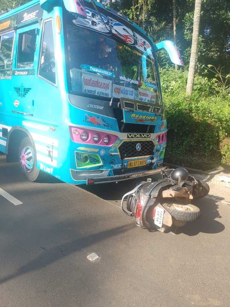 Thamarassery, girl student injured after scooter falls under bus image
