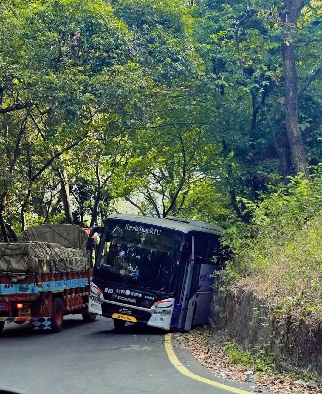 Bus jumps into ditch at Thamarasserychuram Slight traffic disruption