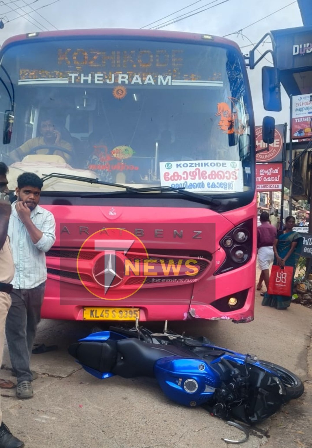thamarassery-a-passenger-had-a-miraculous-escape-after-getting-trapped-under-a-bus-while-riding-a-bike